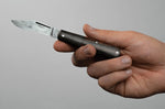 Couteau pliant Böker Barlow Integral Leopard 100501DAM manche en micarta noir et bois de fer 8,5cm + étui en feutre