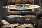 Couteau pliant Böker Barlow Prime Tirpitz Damas 117942DAM manche micarta noir et noyer 8,4cm + étui en feutre