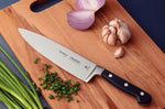 Couteau de chef Tramontina Century lame forgée 25cm manche polycarbonate noir