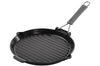 Gril rond Staub 28cm en fonte émaillée noir mat à poignée pliable