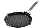 Gril rond Staub 28cm en fonte émaillée noir mat à poignée pliable
