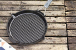 Gril rond Staub 28cm en fonte émaillée noir mat à poignée pliable
