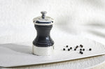 Moulin à poivre manuel Peugeot Palace en bois de hêtre noir satin et métal argenté 10cm