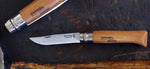 Coffret vitrine en bois Opinel Carbone 10 couteaux de poche manche hêtre