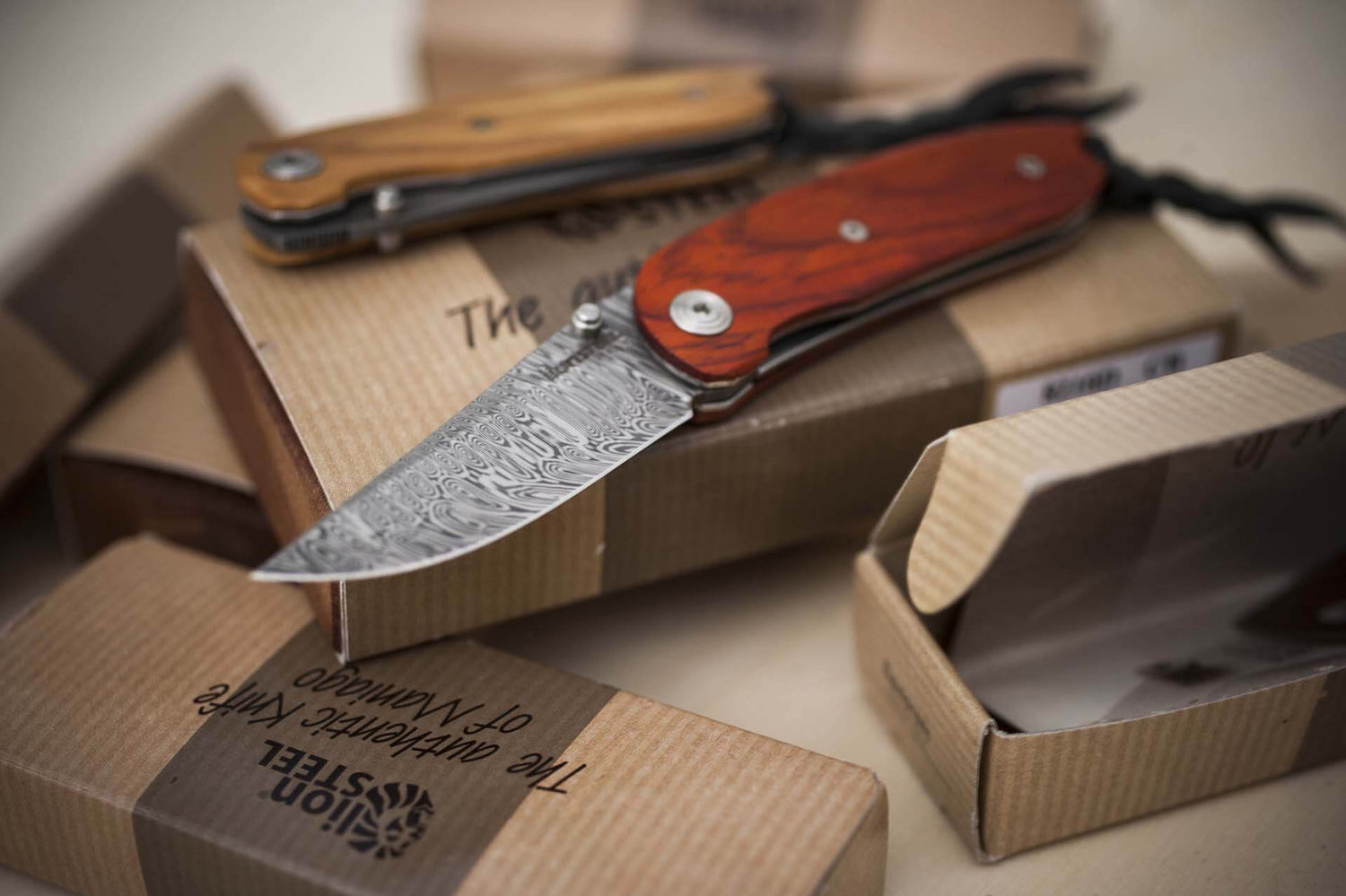 Couteau pliant LionSteel Mini acier damas manche bois de santos 8cm