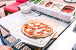 Pelle à pizza perforée Ooni 30cm en aluminium anodisé