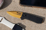 Couteau pliant SOG Ultra XR Gold SGULTRAXRGD manche en fibre de carbone noir 9,1cm